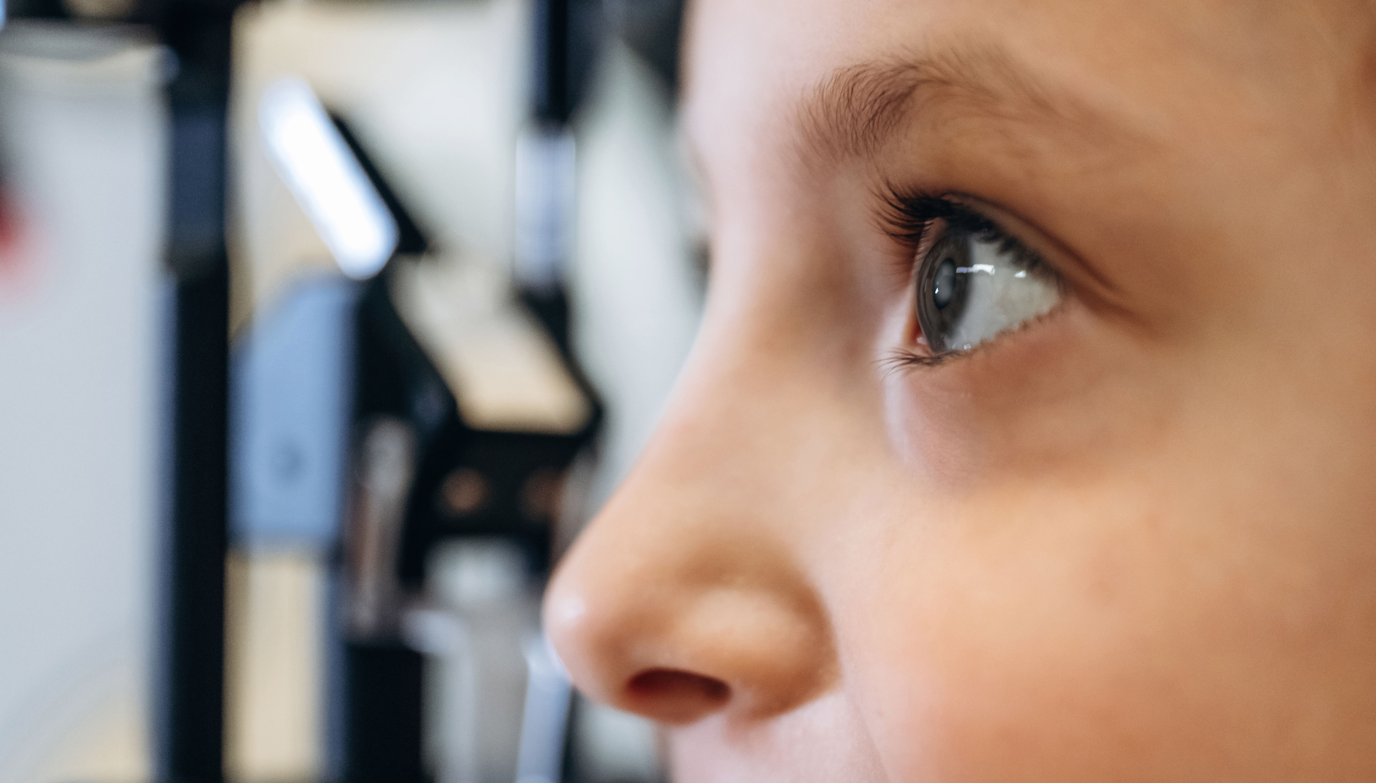 close-up-view-little-girl-is-checking-vision-ophthalmologist-cabinet copy.jpg